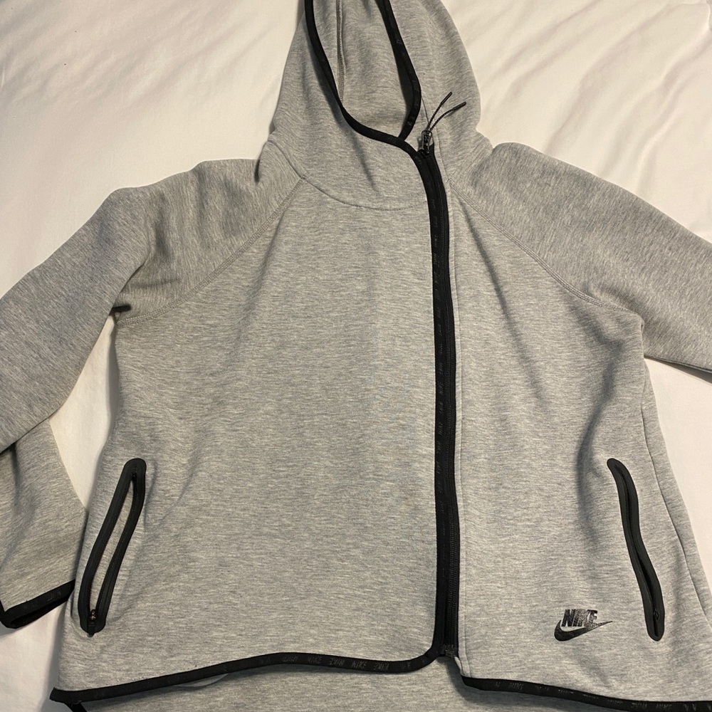 Women’s size M hooded zip-up grey jacket, with thumb holes